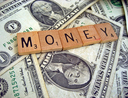 The word "money" spelled out over, well, money.