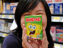 Woman holding Spongebob Band-Aids