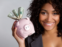 Woman holding a piggy bank