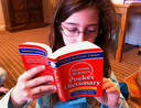 Girl reading the dictionary