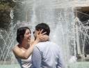 Couple in front of a fountain