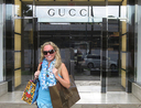 Woman in front of a Gucci store