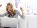 excited woman computer