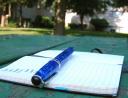 Notebook with budget and pen
