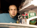 Man looking in his fridge