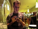Man using his phone at a restaurant