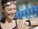 Woman using best underwater watch during swim