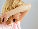 woman covering face