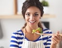 Woman learning how to cook, shop, and eat healthy for one