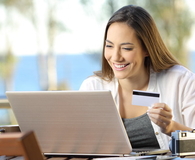 Tourist paying online with a credit card at hotel