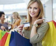 Woman using credit card on everyday spending