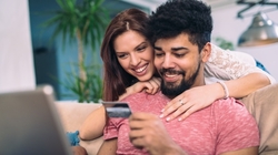 Couple using credit card to get out of debt