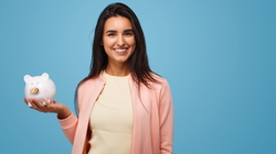 Pretty brunette with moneybox in hands