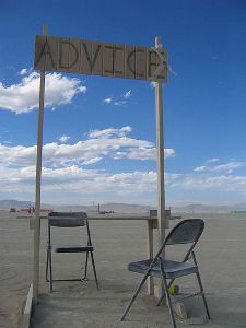 Advice sign with two chairs 