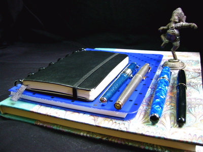 Pens and notebooks with Ganesh